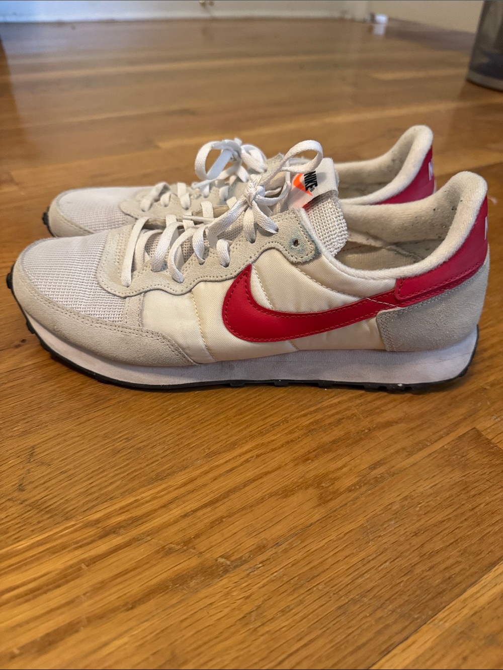 Nike Men's White Sneakers with Red Swoosh Accent